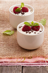 Cream dessert with raspberries