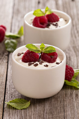 Cream dessert with raspberries