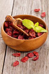 Dried cranberries in a wooden bowl