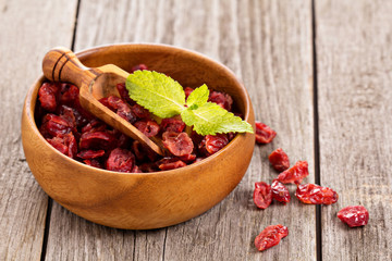 Dried cranberries in a wooden bowl