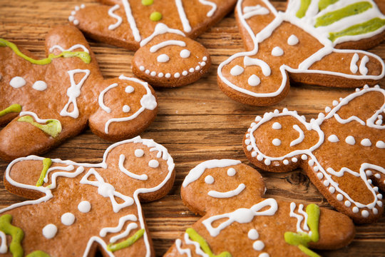 Gingerbread happy creatures on wood