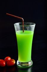 Guava shake drink in glass and tomato