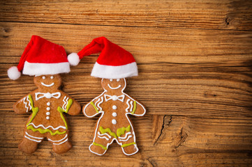 Gingerbread happy creatures on wood