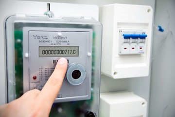 Modern electric meter close up view - obrazy, fototapety, plakaty