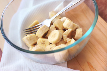 Pieces of banana in a glass bowl