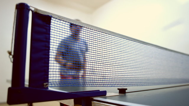 man playing table tennis