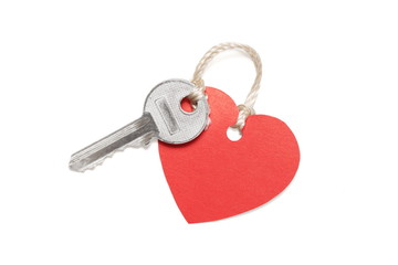 Key with heart shaped blank label isolated on white