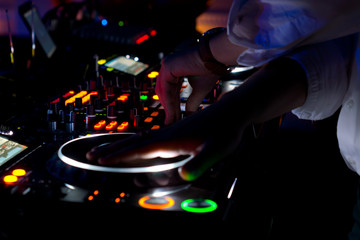 Colourful DJ music deck at night