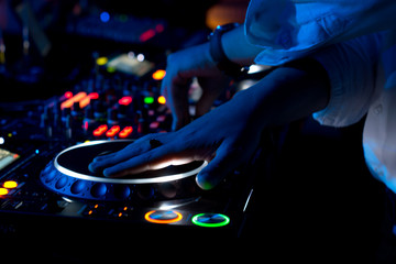 DJ mixing and scratching music at a concert