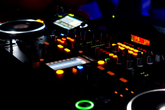 Turntables and music mixing deck at a disco