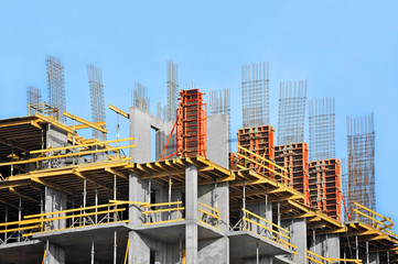Fototapeta premium Building construction site work against blue sky