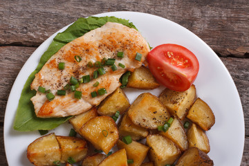 Baked potatoes in skins with chicken. View from above. closeup