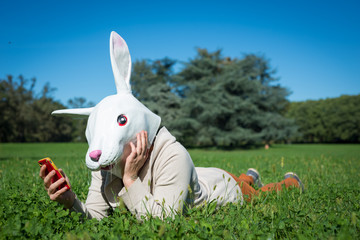 young hipster rabbit mask woman on the phone