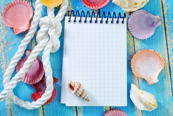 note and sea shell