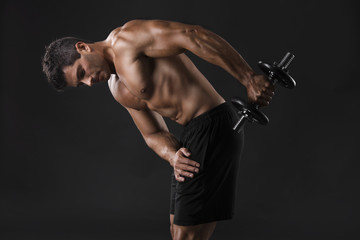 Naklejka na ściany i meble Muscular man lifting weights