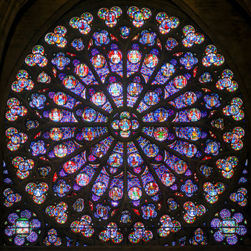 Rose stained glass window in cathedral of Notre Dame, Paris, France