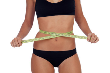 Girl in black underwear with a tape measure around her waist