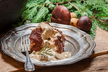 Roasted venison served with mushroom sauce