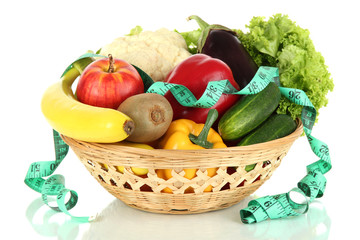Fresh vegetables in wicker basket isolated on white