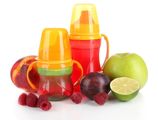 Fruits and baby bottles with compote isolated on white