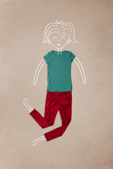 Placed clothes in action with woman drawing