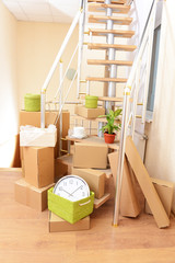 Stack of cartons near stairs: moving house concept
