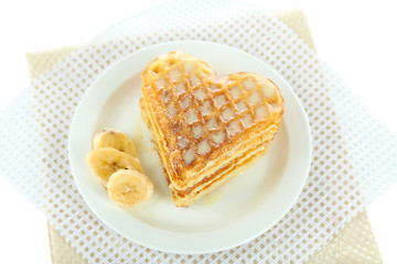 Sweet Belgium waffles with banana, isolated on white