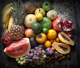 Zelfklevend Fotobehang Exotic fruits variety still life on vintage wooden boards © udra11