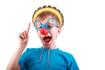 Beautiful funny boy as clown with red nose raises index finger