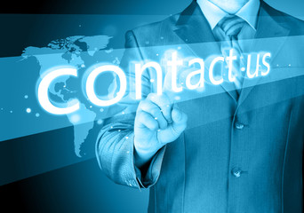 businessman hand pushing contact us button