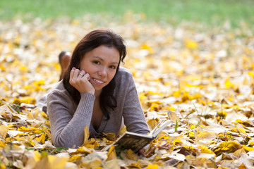 Cute girl with autumn background.