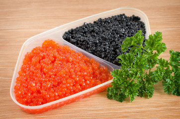 red and black caviar is in a serving plate