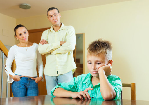 teenage son and parents having quarrel