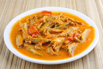 Anchovy curry with coconut and tomato.