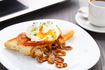 Poached egg with mushrooms and tomatoes