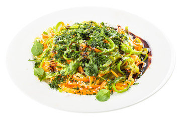 plate with mixed salad isolated on white
