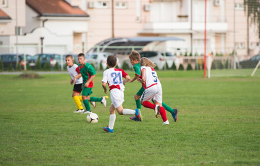 Obraz premium boys kicking football