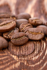Coffee beans on wood background