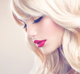 Beautiful Blond Girl with Healthy Long Wavy Hair. White Hair - obrazy, fototapety, plakaty