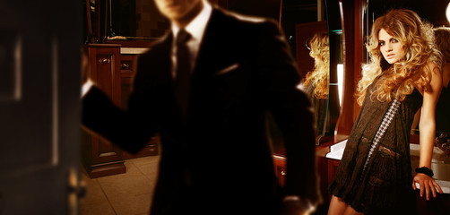 man closing the door to woman's room