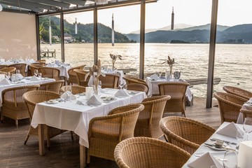 Luxurious restaurant with tables on pier