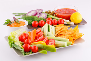 Vegetables, olives, nachos, red and cheese sause