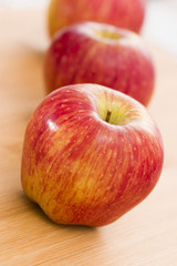 Red Apples on Wooden Table