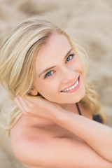 Obraz na płótnie Canvas Overhead Close up portrait of smiling blond at beach