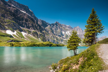 Fototapeta na wymiar Hiking around Truebsee lake in Swiss Alps, Engelberg, Central Sw