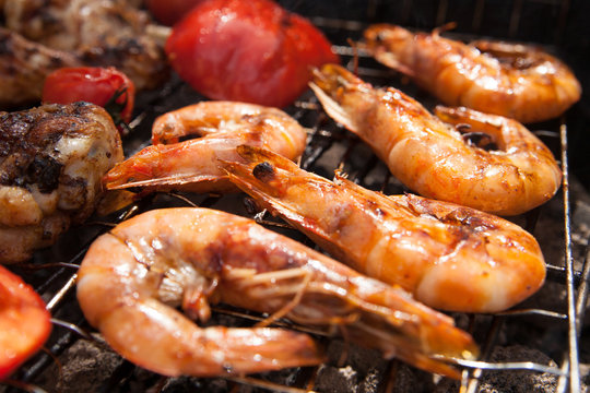 Grilled prawns on the barbecue rack at the garden party