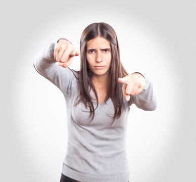 Young angry woman pointing
