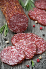 salami and spices on a wooden table