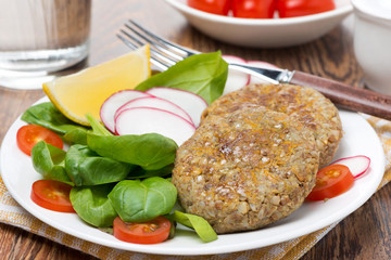 vegetarian burgers made from lentils and buckwheat on the plate