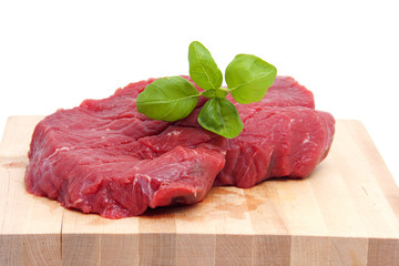 Raw steak meat on cutting board